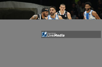 2024-11-17 - Rayjon Tucker (Virtus Bologna) s\in action thwarted by Matteo Tambone (Sassari) during the LBA italian A1 series basketball championship match between Segafredo Virtus Bologna and Banco di Sardegna Dinamo Sassari at Unipol Arena, Casalecchio (Bologna), Italy, November 17, 2024 - Photo: Michele Nucci - VIRTUS SEGAFREDO BOLOGNA VS BANCO DI SARDEGNA SASSARI - ITALIAN SERIE A - BASKETBALL