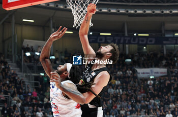 2024-01-06 - Deshawn Freeman (Fortitudo Flats Services Bologna) thwarted by \Marcos Delia (Apu Udine) during the italian basketball LBN A2 series championship match Fortitudo Flats Services Bologna Vs Apu Old Wild West Udine - Bologna, Italy, January 06, 2024 at Paladozza sports hall - Photo: Michele Nucci - FORTITUDO BOLOGNA VS UDINE - ITALIAN SERIE A2 - BASKETBALL