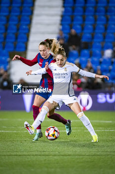 2024-01-17 - Caroline Graham (L) of Barcelona fight for the ball against Olga Carmona (R) of Real Madrid during the women football match valid for the semi final of the Spanish Supercopa tournament between Barcelona and Real Madrid played at Estadio Butarque in Leganes, Spain. - BARCELONA VS REAL MADRID - OTHER - SOCCER