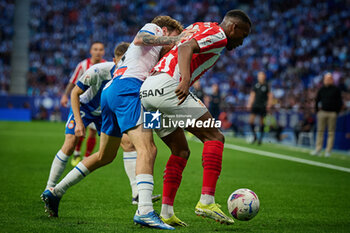 2024-06-13 - Kembo (Sporting de Gijon) and Calero (RCD Espanyol) battle for the ball during a Playoff La Liga Hypermotion match between RCD Espanyol and Real Sporting at Stage Front Stadium, in Barcelona, ,Spain on June 13, 2024. Photo by Felipe Mondino - RCD ESPANYOL - REAL SPORTING - OTHER - SOCCER