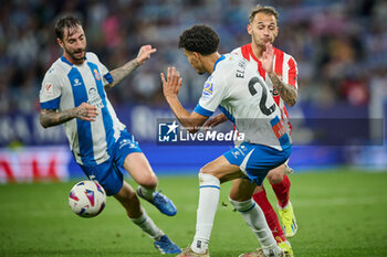 2024-06-13 - Omar El Hilali (RCD Espanyol) and Villalba (Sporting de Gijon) battle for the ball during a Playoff La Liga Hypermotion match between RCD Espanyol and Real Sporting at Stage Front Stadium, in Barcelona, ,Spain on June 13, 2024. Photo by Felipe Mondino - RCD ESPANYOL - REAL SPORTING - OTHER - SOCCER