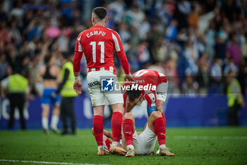 2024-06-13 - Insua (Sporting de Gijon) and Campu (Sporting de Gijon) look dejected during a Playoff La Liga Hypermotion match between RCD Espanyol and Real Sporting at Stage Front Stadium, in Barcelona, ,Spain on June 13, 2024. Photo by Felipe Mondino - RCD ESPANYOL - REAL SPORTING - OTHER - SOCCER