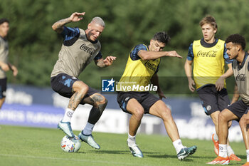 2024-07-11 - Napoli's Italian defender Pasquale Mazzocchi challenges for the ball with Napoli's Argentinian forward Giovanni Simeone during SSC Napoli's 2024-25 preseason training camp in val di sole in Trentino, Dimaro Folgarida

 - SSC NAPOLI TRAINING - OTHER - SOCCER