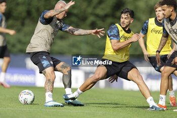 2024-07-11 - Napoli's Italian defender Pasquale Mazzocchi challenges for the ball with Napoli's Argentinian forward Giovanni Simeone during SSC Napoli's 2024-25 preseason training camp in val di sole in Trentino, Dimaro Folgarida

 - SSC NAPOLI TRAINING - OTHER - SOCCER