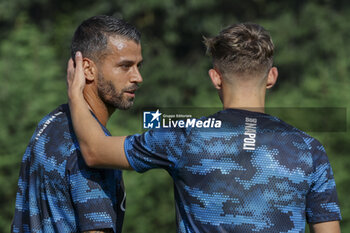 2024-07-11 - Napoli's Italian defender Leonardo Spinazzola and Napoli's Danish midfielder Jesper Lindstrom during SSC Napoli's 2024-25 preseason training camp in val di sole in Trentino, Dimaro Folgarida

 - SSC NAPOLI TRAINING - OTHER - SOCCER