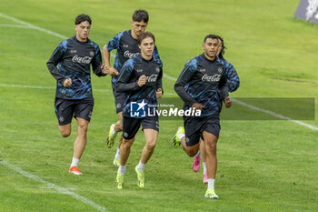 2024-07-12 - Napoli's Italian midfielder Alessio Zerbin (L) and Napoli's Moroccan forward Walid Cheddira during SSC Napoli's 2024-25 preseason training camp in val di sole in Trentino, Dimaro Folgarida

 - SSC NAPOLI TRAINING - OTHER - SOCCER