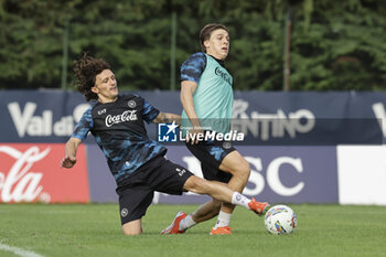 2024-07-12 - Napoli's Portuguese defender Mario Rui challenges for the ball with Napoli's Italian midfielder Alessio Zerbin during SSC Napoli's 2024-25 preseason training camp in val di sole in Trentino, Dimaro Folgarida

 - SSC NAPOLI TRAINING - OTHER - SOCCER