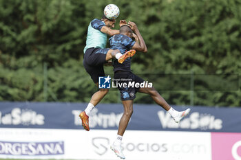 2024-07-12 - Napoli's Italian defender Francesco Mezzoni challenges for the ball with Napoli's Nigerian forward Victor Osimhen during SSC Napoli's 2024-25 preseason training camp in val di sole in Trentino, Dimaro Folgarida

 - SSC NAPOLI TRAINING - OTHER - SOCCER