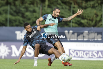 2024-07-12 - Napoli's Italian defender Francesco Mezzoni (R) challenges for the ball with Napoli's Swedish midfielder Jens Cajuste during SSC Napoli's 2024-25 preseason training camp in val di sole in Trentino, Dimaro Folgarida

 - SSC NAPOLI TRAINING - OTHER - SOCCER