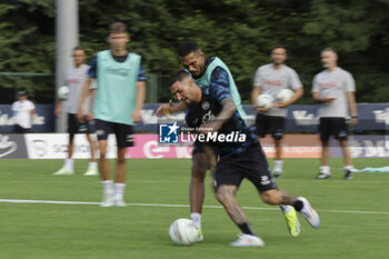 2024-07-12 - Napoli's Italian forward Matteo Politano challenges for the ball with Napoli's Brazilian defender Juan Jesus during SSC Napoli's 2024-25 preseason training camp in val di sole in Trentino, Dimaro Folgarida

 - SSC NAPOLI TRAINING - OTHER - SOCCER