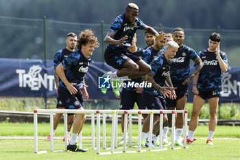 2024-07-13 - Napoli's Portuguese defender Mario Rui (L) Napoli's Nigerian forward Victor Osimhen and Napoli's Italian defender Pasquale Mazzocchi during SSC Napoli's 2024-25 preseason training camp in val di sole in Trentino, Dimaro Folgarida

 - SSC NAPOLI TRAINING - OTHER - SOCCER