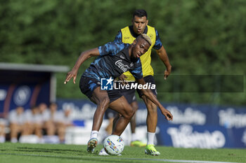 2024-07-13 - Napoli's Nigerian forward Victor Osimhen challenges for the ball with Napoli's Moroccan forward Walid Cheddira during SSC Napoli's 2024-25 preseason training camp in val di sole in Trentino, Dimaro Folgarida

 - SSC NAPOLI TRAINING - OTHER - SOCCER