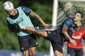 2024-07-13 - Napoli's Italian defender Francesco Mezzoni challenges for the ball with Napoli's Argentinian forward Giovanni Simeone during SSC Napoli's 2024-25 preseason training camp in val di sole in Trentino, Dimaro Folgarida

 - SSC NAPOLI TRAINING - OTHER - SOCCER