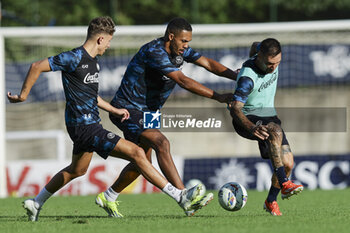 2024-07-13 - Napoli's Italian forward Matteo Politano challenges for the ball with Napoli's Brazilian defender Juan Jesus during SSC Napoli's 2024-25 preseason training camp in val di sole in Trentino, Dimaro Folgarida

 - SSC NAPOLI TRAINING - OTHER - SOCCER