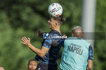 2024-07-13 - Napoli's Danish midfielder Jesper Lindstrom challenges for the ball with Napoli's Italian defender Pasquale Mazzocchi during SSC Napoli's 2024-25 preseason training camp in val di sole in Trentino, Dimaro Folgarida

 - SSC NAPOLI TRAINING - OTHER - SOCCER