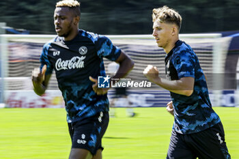 2024-07-14 - Napoli's Nigerian forward Victor Osimhen and Napoli's Danish midfielder Jesper Lindstrom during SSC Napoli's 2024-25 preseason training camp in val di sole in Trentino, Dimaro Folgarida

 - SSC NAPOLI TRAINING - OTHER - SOCCER