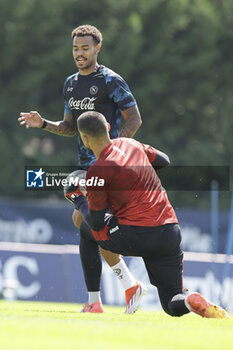 2024-07-15 - Napoli's Belgian forward Cyril Ngonge challenges for the ball with Napoli's Italian goalkeeper Elia Caprile during SSC Napoli's 2024-25 preseason training camp in val di sole in Trentino, Dimaro Folgarida

 - SSC NAPOLI TRAINING - OTHER - SOCCER