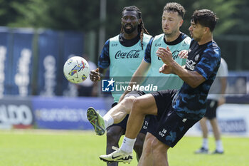 2024-07-17 - Napoli's Kosovar defender Amir Rrahmani challenges for the ball with Napoli's Argentinian forward Giovanni Simeone during SSC Napoli's 2024-25 preseason training camp in val di sole in Trentino, Dimaro Folgarida

 - SSC NAPOLI TRAINING - OTHER - SOCCER