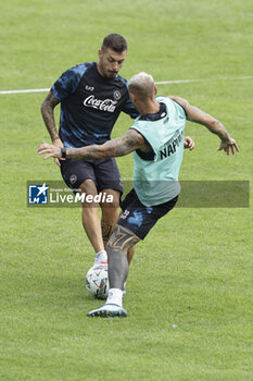 2024-07-17 - Napoli's Italian midfielder Gianluca Gaetano challenges for the ball with Napoli's Italian defender Pasquale Mazzocchi during SSC Napoli's 2024-25 preseason training camp in val di sole in Trentino, Dimaro Folgarida

 - SSC NAPOLI TRAINING - OTHER - SOCCER