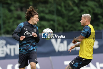 2024-07-19 - Napoli's Portuguese defender Mario Rui challenges for the ball with Napoli's Italian defender Pasquale Mazzocchi during SSC Napoli's 2024-25 preseason training camp in val di sole in Trentino, Dimaro Folgarida

 - SSC NAPOLI TRAINING - OTHER - SOCCER