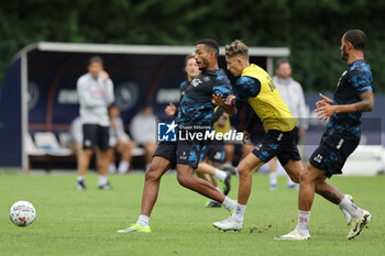 2024-07-19 - Napoli's Brazilian defender Juan Jesus challenges for the ball with Napoli's Danish midfielder Jesper Lindstrom during SSC Napoli's 2024-25 preseason training camp in val di sole in Trentino, Dimaro Folgarida

 - SSC NAPOLI TRAINING - OTHER - SOCCER