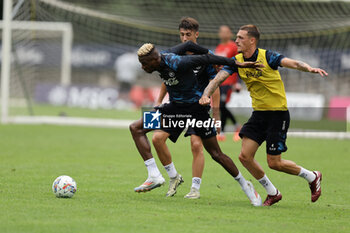 2024-07-19 - Napoli's Nigerian forward Victor Osimhen challenges for the ball with Napoli's Spanish defender Rafa Marin during SSC Napoli's 2024-25 preseason training camp in val di sole in Trentino, Dimaro Folgarida

 - SSC NAPOLI TRAINING - OTHER - SOCCER