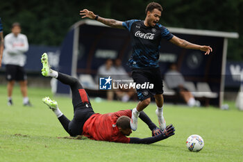 2024-07-19 - Napoli's Belgian forward Cyril Ngonge challenges for the ball with Napoli's Italian goalkeeper Nikita Contini during SSC Napoli's 2024-25 preseason training camp in val di sole in Trentino, Dimaro Folgarida

 - SSC NAPOLI TRAINING - OTHER - SOCCER