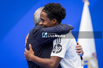 2024-07-27 - Endrick Felipe Moreira de Sousa (L) hugs Florentino Perez (R), president of Real Madrid, during his presentation at Estadio Santiago Bernabeu on July 27, 2024 in Madrid, Spain. - REAL MADRID UNVEILS NEW SIGNING ENDRICK - OTHER - SOCCER