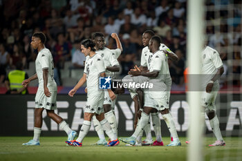 2024-08-12 - Takumi Minamino (AS Monaco) celebrates after scoring his team's goal with team mates during a Joan Gamper Trophy at Estadi Olimpic Lluis Companys in Barcelona, Spain, on August 12 2024. Photo by Felipe Mondino - TROFEU JOAN GAMPER: FC BARCELONA - AS MONACO - OTHER - SOCCER