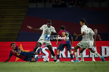 2024-08-12 - Lamine Yamal (FC Barcelona) and Youssouf Fofana (AS Monaco) battle for the ball during a Joan Gamper Trophy at Estadi Olimpic Lluis Companys in Barcelona, Spain, on August 12 2024. Photo by Felipe Mondino - TROFEU JOAN GAMPER: FC BARCELONA - AS MONACO - OTHER - SOCCER