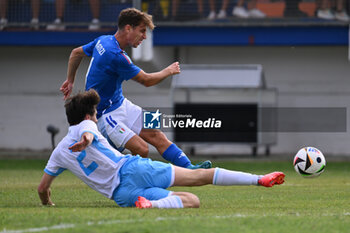 2024-09-05 - Tommaso Baldanzi (ITA) and Matteo Guidi (SMR) during the UEFA U21 Euro 2025 Qualifier match between Italy and San Marino at the Domenico Francioni Stadium on September 5, 2024 in Latina, Italy. - UEFA UNDER 21 - ITALY VS SAN MARINO - OTHER - SOCCER