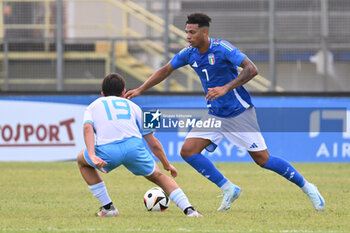 2024-09-05 - Marco Casadei (SMR) and Cher Ndour (ITA) during the UEFA U21 Euro 2025 Qualifier match between Italy and San Marino at the Domenico Francioni Stadium on September 5, 2024 in Latina, Italy. - UEFA UNDER 21 - ITALY VS SAN MARINO - OTHER - SOCCER