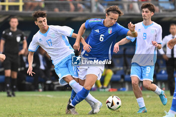 2024-09-05 - Nicolo Chiaruzzi (SMR) and Daniele Ghilardi (ITA) during the UEFA U21 Euro 2025 Qualifier match between Italy and San Marino at the Domenico Francioni Stadium on September 5, 2024 in Latina, Italy. - UEFA UNDER 21 - ITALY VS SAN MARINO - OTHER - SOCCER