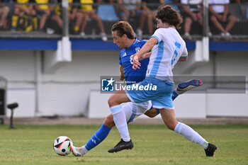 2024-09-05 - Edoardo Bove (ITA) and Giacomo Matteoni (SMR) during the UEFA U21 Euro 2025 Qualifier match between Italy and San Marino at the Domenico Francioni Stadium on September 5, 2024 in Latina, Italy. - UEFA UNDER 21 - ITALY VS SAN MARINO - OTHER - SOCCER