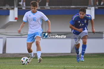 2024-09-05 - Filippo Pasolini (SMR) and Niccolo Pisilli (ITA) during the UEFA U21 Euro 2025 Qualifier match between Italy and San Marino at the Domenico Francioni Stadium on September 5, 2024 in Latina, Italy. - UEFA UNDER 21 - ITALY VS SAN MARINO - OTHER - SOCCER