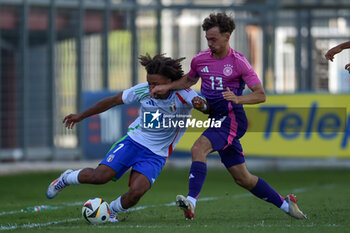 2024-09-10 - Italia's U20 Aaron Ciammaglichella in action against Germany's U20 Aaron Zenhter during the match Elite League Italy U20 - Germany U20 at the 