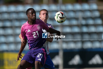 2024-09-10 - Italia's U20 Pietro Comuzzo in action against Germany's U20 Ilyas Ansah during the match Elite League Italy U20 - Germany U20 at the 