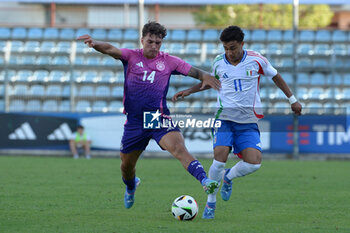 2024-09-10 - Italia's U20 Dominic Vavassori in action against Germany's U20 Julian Pauli during the match Elite League Italy U20 - Germany U20 at the 