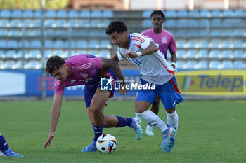 2024-09-10 - Italia's U20 Dominic Vavassori in action against Germany's U20 Julian Pauli during the match Elite League Italy U20 - Germany U20 at the 