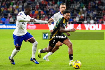 2024-11-18 - Jamaica forward Leon Bailey (7) moves the ball against United States forward Tim Weah (21) and defender Antonee Robinson (5) - CONCACAF NATIONS LEAGUE - USA VS JAMAICA - OTHER - SOCCER