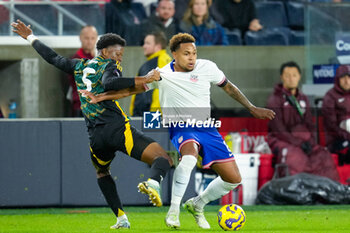 2024-11-18 - United States midfielder Weston McKennie (8) works against Jamaica defender Richard King (5) - CONCACAF NATIONS LEAGUE - USA VS JAMAICA - OTHER - SOCCER