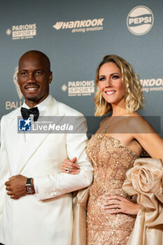 2024-10-28 - Didier Drogba and Sandy Heribert during the red carpet ceremony of the Ballon d'Or (Golden Ball) France Football 2024 on 28 October 2024 at Theatre du Chatelet in Paris, France - FOOTBALL - BALLON D'OR 2024 - RED CARPET CEREMONY - OTHER - SOCCER