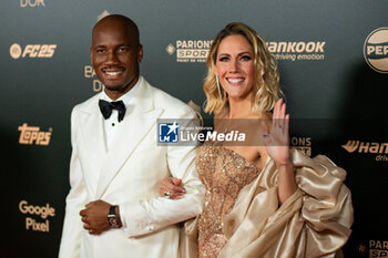 2024-10-28 - Didier Drogba and Sandy Heribert during the red carpet ceremony of the Ballon d'Or (Golden Ball) France Football 2024 on 28 October 2024 at Theatre du Chatelet in Paris, France - FOOTBALL - BALLON D'OR 2024 - RED CARPET CEREMONY - OTHER - SOCCER