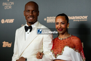 2024-10-28 - Didier Drogba and his wife Gabrielle Lemaire during the red carpet ceremony of the Ballon d'Or (Golden Ball) France Football 2024 on 28 October 2024 at Theatre du Chatelet in Paris, France - FOOTBALL - BALLON D'OR 2024 - RED CARPET CEREMONY - OTHER - SOCCER