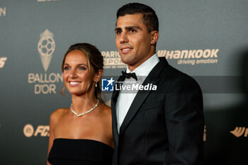 2024-10-28 - Rodrigo Hernandez Cascante and Laura Iglesias during the red carpet ceremony of the Ballon d'Or (Golden Ball) France Football 2024 on 28 October 2024 at Theatre du Chatelet in Paris, France - FOOTBALL - BALLON D'OR 2024 - RED CARPET CEREMONY - OTHER - SOCCER