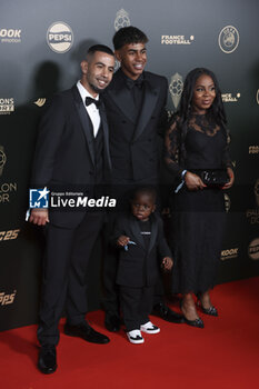 2024-10-28 - Lamine Yamal, his younger brother and his parents Sheila Ebana and Mounir Nasraoui attend the 68th Ballon D'Or France Football 2024 photocall on October 28, 2024 at Theatre du Chatelet in Paris, France - FOOTBALL - BALLON D'OR 2024 - OTHER - SOCCER