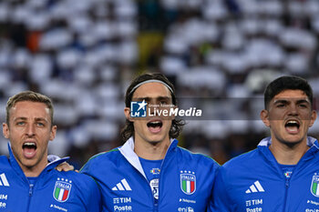 2024-06-09 - Italy's midfielder Davide Frattesi, Italy's defender Riccardo Calafiori and Italy's defender Raoul Bellanova during the anthem - ITALY VS BOSNIA - FRIENDLY MATCH - SOCCER