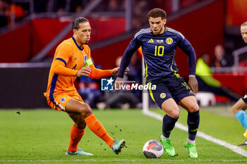 2024-03-22 - Virgil van Dijk of Netherlands battles for possession with Che Adams of Scotland during the International Friendly football match between Netherlands and Scotland on March 22, 2024 at Johan Cruijff ArenA in Amsterdam, Netherlands - FOOTBALL - FRIENDLY GAME - NETHERLANDS V SCOTLAND - FRIENDLY MATCH - SOCCER