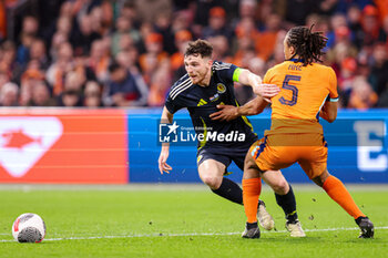 2024-03-22 - Andrew Robertson of Scotland, Nathan Ake of Netherlands during the International Friendly football match between Netherlands and Scotland on March 22, 2024 at Johan Cruijff ArenA in Amsterdam, Netherlands - FOOTBALL - FRIENDLY GAME - NETHERLANDS V SCOTLAND - FRIENDLY MATCH - SOCCER