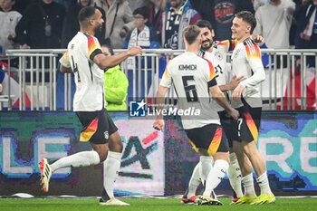 2024-03-23 - Florian WIRTZ of Germany celebrate his goal with teammates during the International Friendly football match between France and Germany on March 23, 2024 at Groupama stadium in Decines-Charpieu near Lyon, France - FOOTBALL - FRIENDLY GAME - FRANCE V GERMANY - FRIENDLY MATCH - SOCCER